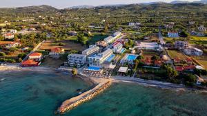 an aerial view of a resort on the beach at Golden Coast Suites in Kypseli