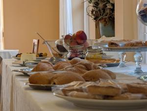 a table with several plates of food on it at Hotel Del Sole in Sora