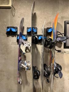a group of skis and snowboards are on display at Daiju Myoko - Renovated in 2025 in Myoko