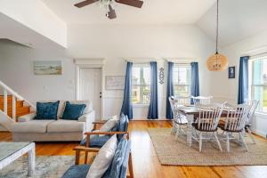 a living room with a table and chairs at 3 King Suites 15 Guests - Sunzout in Bolivar Peninsula