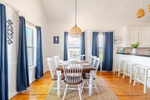 a dining room with a table and chairs at 3 King Suites 15 Guests - Sunzout in Bolivar Peninsula +69 photos