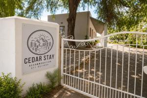 a sign for the cederar stay with a gate at Cedar Stay Clanwilliam in Clanwilliam