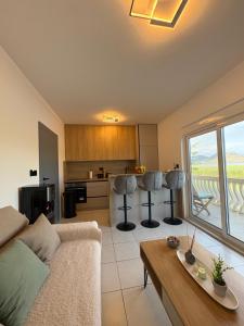 a living room with a couch and a table at Lakeside house in Podgorica