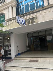 a sign on the side of a building with a sign on it at Niruan apartment in Pattaya