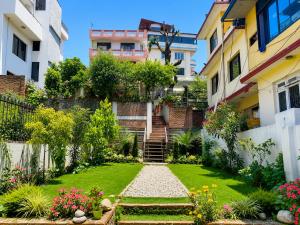 a garden in the middle of a building at Birds Nest Hostel in Kathmandu
