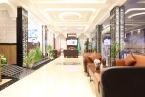 a lobby with couches and plants in a building at إطلالة السيب للشقق المخدومة Itlalat Alseeb Serviced Apartments in Khafji