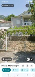 a text message of a house with a dog on a fence at Luka1 in Sutomore