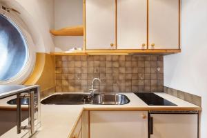 a kitchen with a sink and a window at Apartments Mupan St. Vigil in San Vigilio Di Marebbe +54 photos