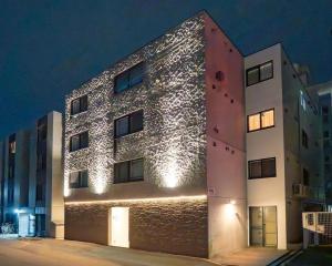 a building with lights on the side of it at Lotus south in Sapporo +58 photos