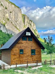 a log cabin with a camera on the roof at Komarnica Forest Owl 3 in Šavnik