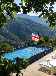a swimming pool with a view of mountains at Villa MERISI in Merisi