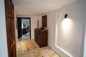 a hallway with a room with a wall with a floor withcorruptionomaly at Medina Loft Your Artistic Escape in Rabat