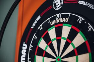 a close up of a dartboard with the word vynkan at Oak House Hotel in Axbridge +16 photos