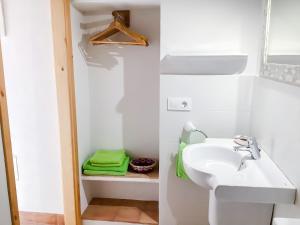 a bathroom with a sink and a mirror at CAN TONI DEN MESTRE in Cala Saona