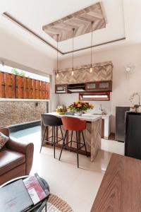a kitchen with a table and a pool in a room at oemah samiya in Keramas