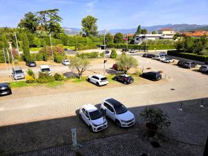 a group of cars parked in a parking lot at Santa Caterina Park Hotel in Sarzana