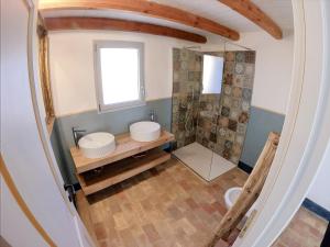 a bathroom with two sinks and a shower at Corte CeLestiale in Albenga +21 photos