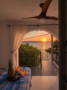 a room with a table with a view of the ocean at Romantic Apartment Sonja, Beachfront in Cesarica
