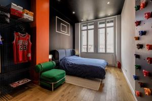 a bedroom with a bed and a hockey jersey at Le Duval 66 in Pontarlier