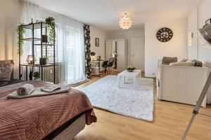 a bedroom with a bed and a living room at Ferienappartement Sonnenhof in Triberg