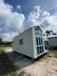 a tiny house sitting on the side of a road at Beach Access Tiny House 06 - Lipa Noi Beach in Koh Samui +5 photos