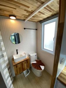 a bathroom with a toilet and a sink and a window at Beach Access Tiny House 06 - Lipa Noi Beach in Koh Samui