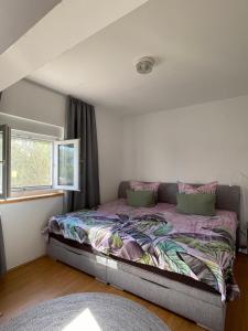 a bedroom with a bed with pink pillows at Villa Canyon Escape 12 Personen in Bilišane +48 photos