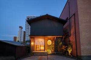 a building with a large window on the side of it at 別府の宿 結 -Yui- in Beppu