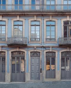 a facade of a building with doors and windows at Vandoma Serviced Apartments in Porto