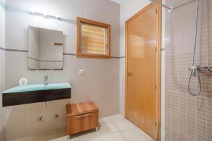 a bathroom with a sink and a shower at Casa Nord in El Port de la Selva +27 photos