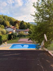 a swimming pool in the yard of a house at Vila Noor Sarajevo in Sarajevo