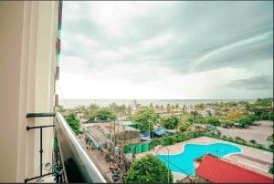 a view from a balcony of a resort with a pool at Chinh Thuỷ Hotel in Sầm Sơn