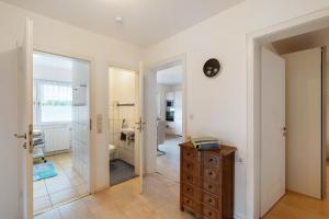 a room with a bathroom with a sink and a toilet at Haus Am Schroffen in Ottenhöfen +45 photos