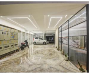 a parking lot with a car parked in a garage at Hotel Heritage Suites in New Delhi