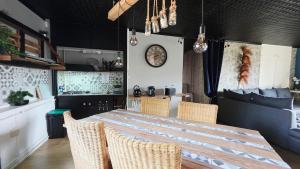 a dining room with a large table and chairs at Domaine Les Tourelles - Gîte 4 in Caffiers