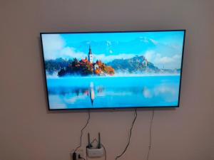 a flat screen tv hanging on a wall at شقق وهوستل قصر الشباب للمصريين و المقيمين فقط Youth Palace Hostel & Apartments for Egyptians & Residents Only in Alexandria