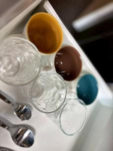 a sink with two glasses and a cup on it at ITOSHI Kyoto Stay 京都天神401 in Kyoto +14 photos