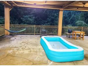 a blue inflatable swimming pool on a patio at MAPLE HOUSE - Vacation STAY 13294v in Tsuru 