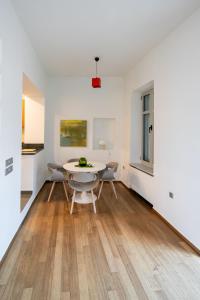 a dining area with a table and chairs in a room at Acropolis Neoclassic Elegance in Athens +33 photos