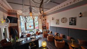 a restaurant with chairs and tables in a room at No32 Hotel in Edinburgh