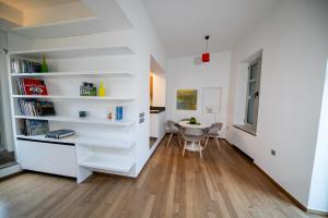 a room with white shelves and a table in it at Acropolis Neoclassic Elegance in Athens