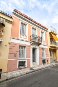 a colorful building on the side of a street at Acropolis Neoclassic Elegance in Athens