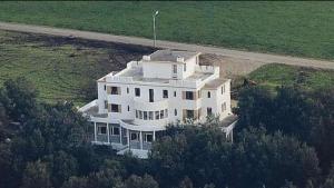 an aerial view of a large white house at Ørntua in Rekdal