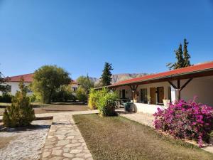 a building with pink flowers in front of it at BKZ Self-Catering in Solitaire