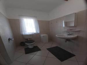 a bathroom with a toilet and a sink at BKZ Self-Catering in Solitaire +73 photos
