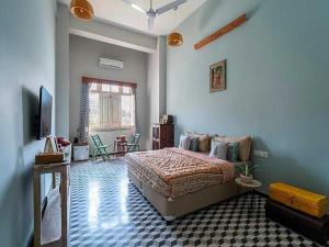 a bedroom with a bed and a tv in it at DanCenter Kolpol by CheckIn Udaipur in Udaipur