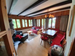 an aerial view of a living room with a table and chairs at Dent-Blanche in Les Collons
