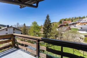 a balcony with a view of a town at Haus Tannenberg in Todtnau