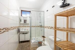 a bathroom with a glass shower and a toilet at Haus Tannenberg in Todtnau +83 photos