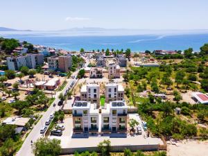 an aerial view of a city with buildings and the ocean at Emili Premium Residence in Qeparo